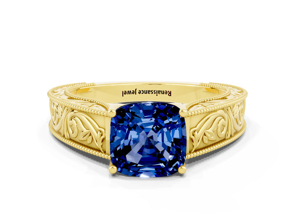 Yellow gold Cushion Cut Blue Sapphire Solitaire Ring with Engraved Band and Four-Prong Setting