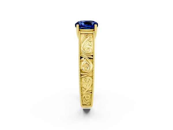 Yellow gold Cushion Cut Blue Sapphire Solitaire Ring with Engraved Band and Four-Prong Setting