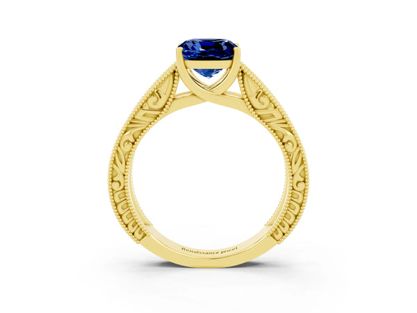 Yellow gold Cushion Cut Blue Sapphire Solitaire Ring with Engraved Band and Four-Prong Setting