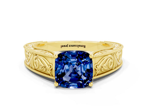 Yellow gold Cushion Cut Blue Sapphire Solitaire Ring with Engraved Band and Four-Prong Setting