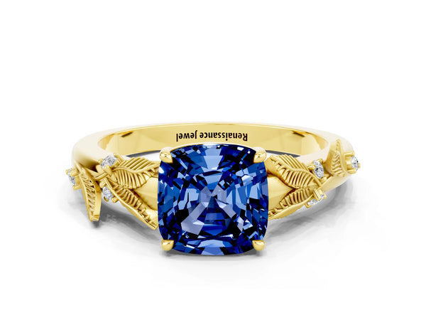 Yellow gold Cushion Cut Blue Sapphire Solitaire Ring with Leaf Motif Band and Four-Prong Setting