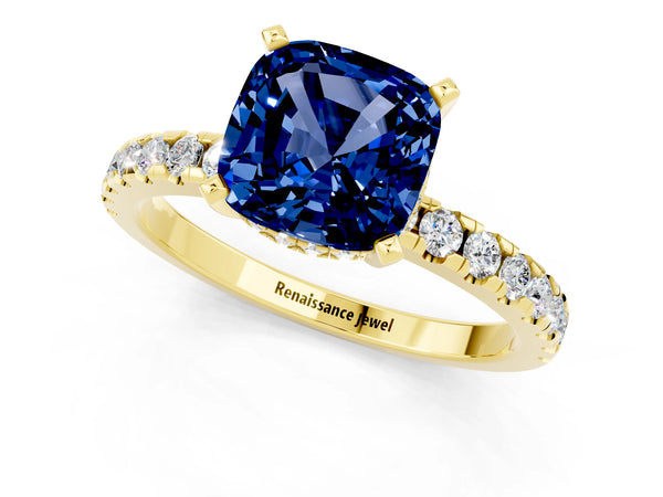 Yellow gold Cushion Cut Blue Sapphire Solitaire Ring with Round Pavé Band and Four-Prong Setting