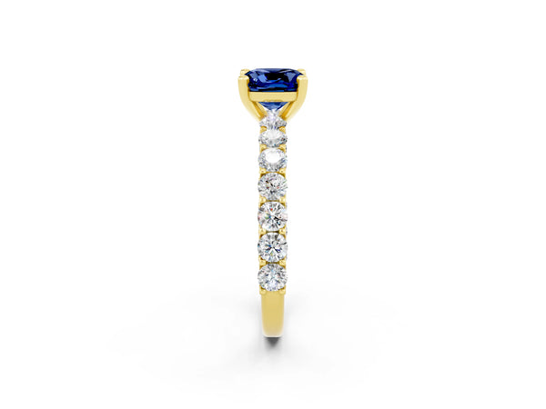 Yellow gold Cushion Cut Blue Sapphire Solitaire Ring with Shared Prong Pavé Band and Four-Prong Setting