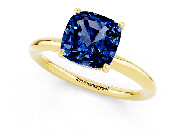 Yellow gold Cushion Cut Blue Sapphire Solitaire Ring with Thin Band and Four-Prong Setting