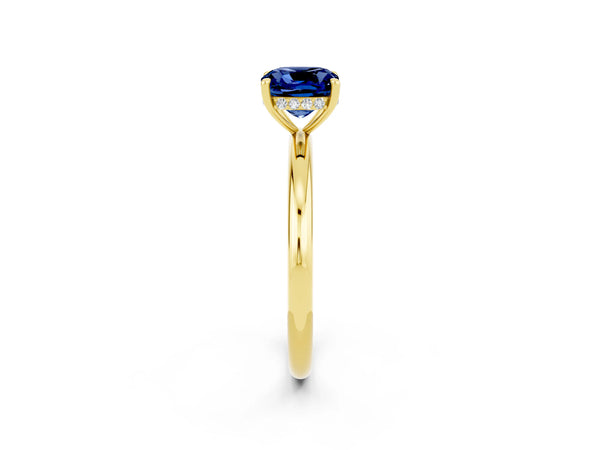 Yellow gold Cushion Cut Blue Sapphire Solitaire Ring with Thin Band and Four-Prong Setting