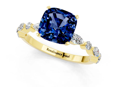 Yellow gold Cushion Cut Blue Sapphire Solitaire with Side Stones on a Pavé Band and Four-Prong Setting_1