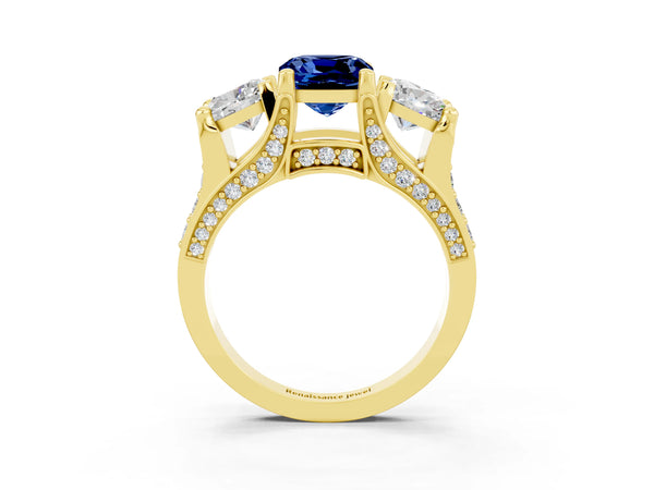 Yellow gold Cushion Cut Blue Sapphire Three-Stone Ring with Channel Set Band and Four-Prong Setting
