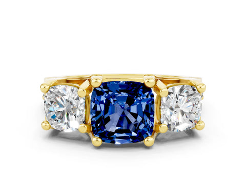Yellow gold Cushion Cut Blue Sapphire Three-Stone Ring with Channel Set Band and Four-Prong Setting