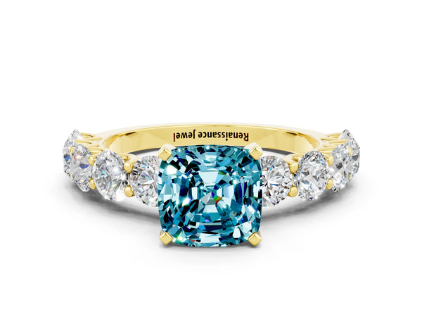 Yellow gold Cushion Cut Blue Topaz Prong Setting with Side Stones on a Pave Band