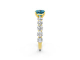Yellow gold Cushion Cut Blue Topaz Prong Setting with Side Stones on a Pave Band_2