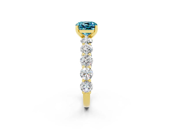 Yellow gold Cushion Cut Blue Topaz Prong Setting with Side Stones on a Pave Band