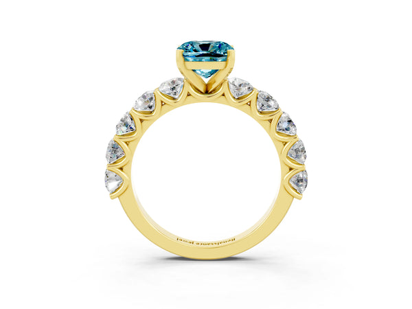 Yellow gold Cushion Cut Blue Topaz Prong Setting with Side Stones on a Pave Band
