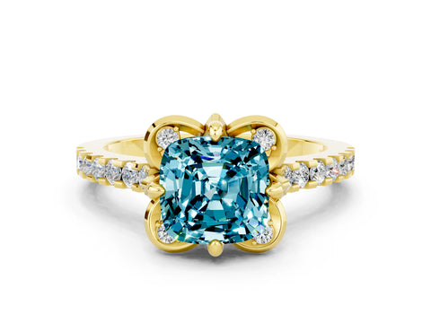 Yellow gold Cushion Cut Blue Topaz Ring with Pavé Band and Floral Prong Setting