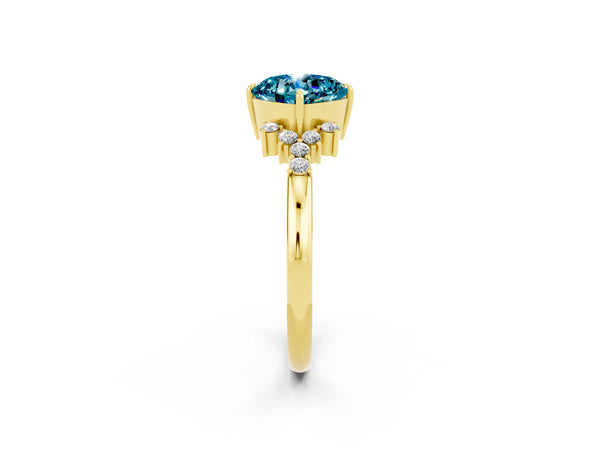 Yellow gold Cushion Cut Blue Topaz Ring with Side Stones and Four-Prong Setting