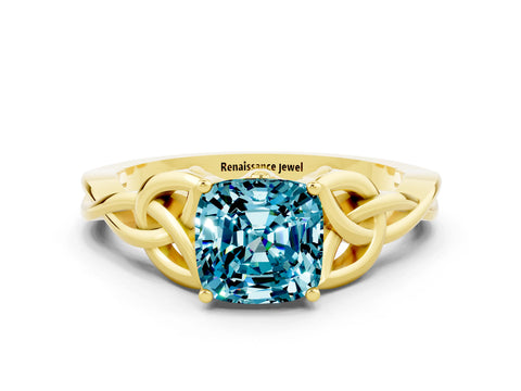 Yellow gold Cushion Cut Blue Topaz Solitaire Engagement Ring with Celtic Knot Band and Four-Prong Setting
