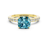 Yellow gold Cushion Cut Blue Topaz Solitaire Engagement Ring with Pavé Band and Four-Prong Setting