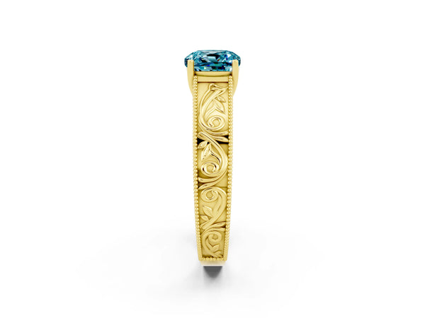 Yellow gold Cushion Cut Blue Topaz Solitaire Ring with Engraved Band and Four-Prong Setting