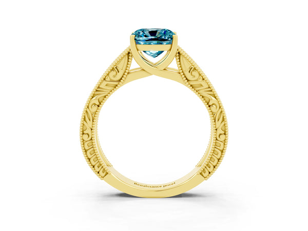Yellow gold Cushion Cut Blue Topaz Solitaire Ring with Engraved Band and Four-Prong Setting