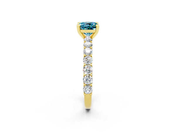 Yellow gold Cushion Cut Blue Topaz Solitaire Ring with Shared Prong Pavé Band and Four-Prong Setting