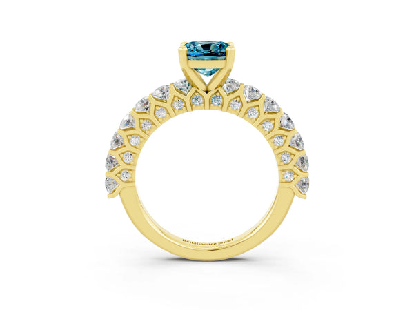 Yellow gold Cushion Cut Blue Topaz Solitaire Ring with Shared Prong Pavé Band and Four-Prong Setting