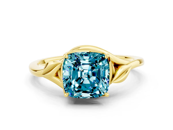 Yellow gold Cushion Cut Blue Topaz Solitaire Ring with Twist Band and Four-Prong Setting