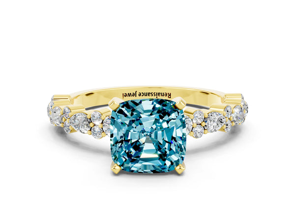 Yellow gold Cushion Cut Blue Topaz Side Stone Solitaire Ring with Round  and Four-Prong Setting