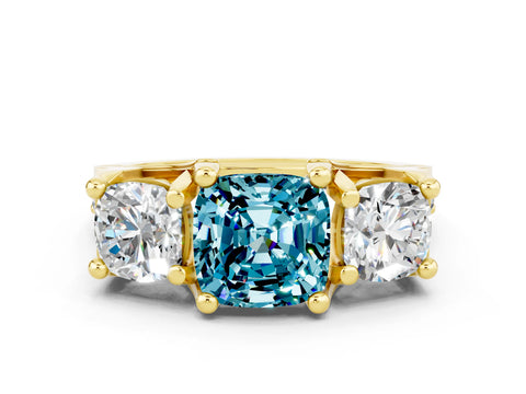 Yellow gold Cushion Cut Blue Topaz Three-Stone Ring with Channel Set Band and Four-Prong Setting