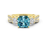 Yellow gold Cushion Cut Blue Topaz Three-Stone Ring with Pavé Split Shank and Four-Prong Setting_24