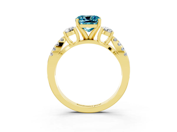 Yellow gold Cushion Cut Blue Topaz Three-Stone Ring with Pavé Split Shank and Four-Prong Setting