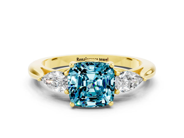 Yellow gold Cushion Cut Blue Topaz Three-Stone Ring with Pear  Side Stones and Prong Setting