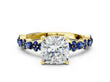 Yellow gold Cushion Cut Diamond Side Stone Solitaire Ring with Round with Blue Sapphire side stone and Four-Prong Setting