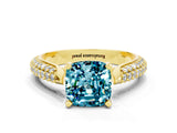 Yellow gold Cushion Cut Diamond Solitaire Engagement Ring with Pavé Band and Four-Prong Setting