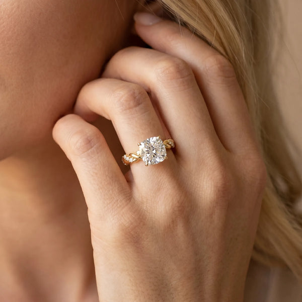 Yellow gold Cushion Cut Diamond Solitaire Ring with Twisted Band and Pavé Accents