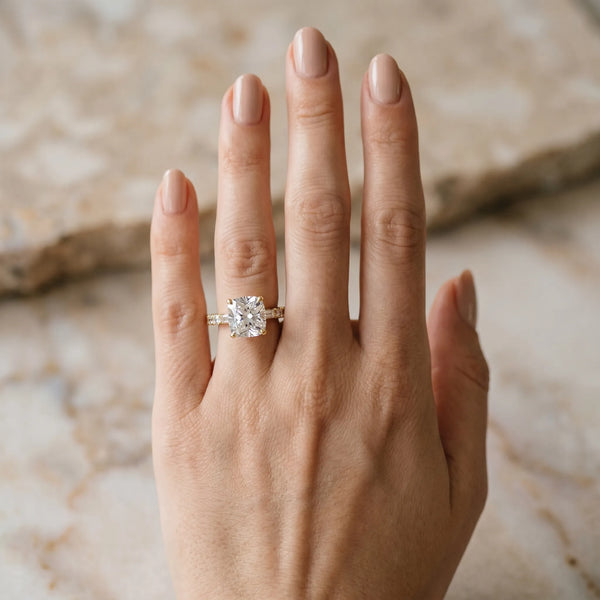 Yellow gold Cushion Cut Diamond Solitaire with Side Baguettes and Channel Set Band