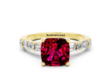 Yellow gold Cushion Cut Garnet Solitaire with Side Baguettes and Channel Set Band