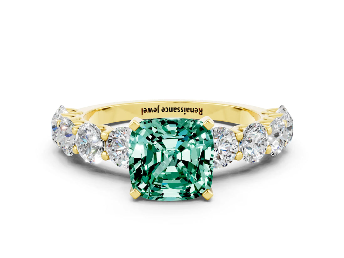 Yellow gold Cushion Cut Green Sapphire Prong Setting with Side Stones on a Pave Band