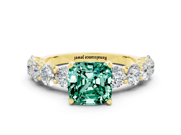 Yellow gold Cushion Cut Green Sapphire Prong Setting with Side Stones on a Pave Band