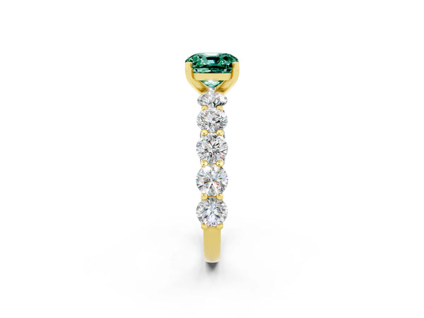 Yellow gold Cushion Cut Green Sapphire Prong Setting with Side Stones on a Pave Band