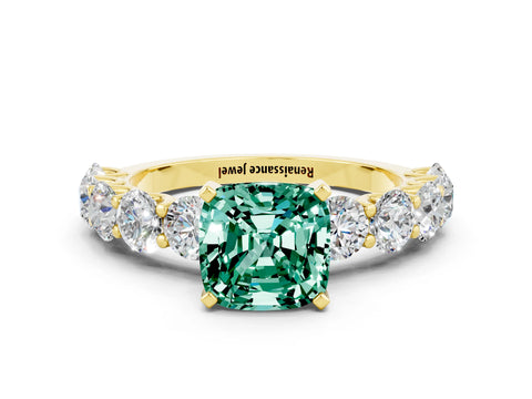 Yellow gold Cushion Cut Green Sapphire Prong Setting with Side Stones on a Pave Band