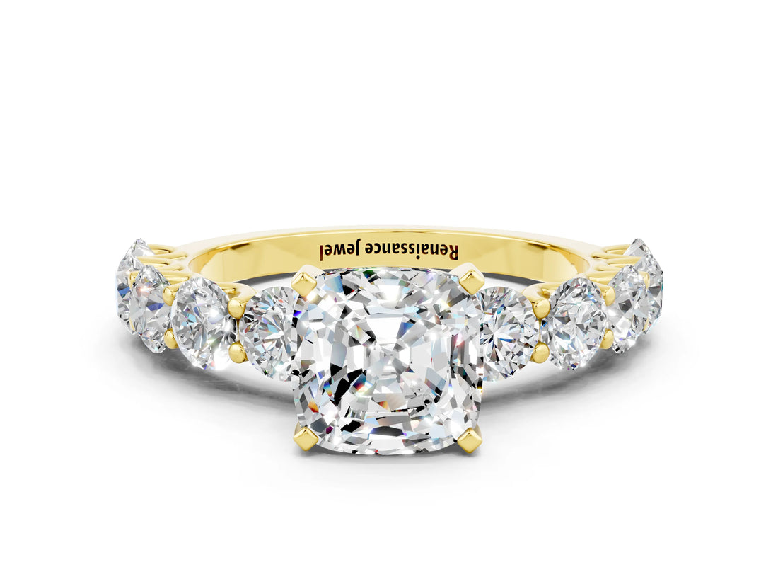 Yellow gold Cushion Cut Moissanite Prong Setting with Side Stones on a Pave Band