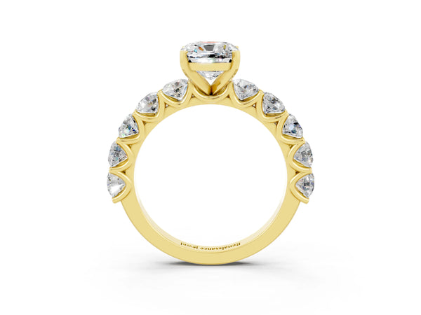 Yellow gold Cushion Cut Moissanite Prong Setting with Side Stones on a Pave Band