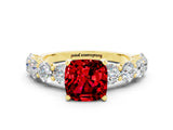 Yellow gold Cushion Cut Ruby Prong Setting with Side Stones on a Pave Band