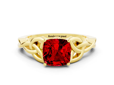 Yellow gold Cushion Cut Ruby Solitaire Engagement Ring with Celtic Knot Band and Four-Prong Setting