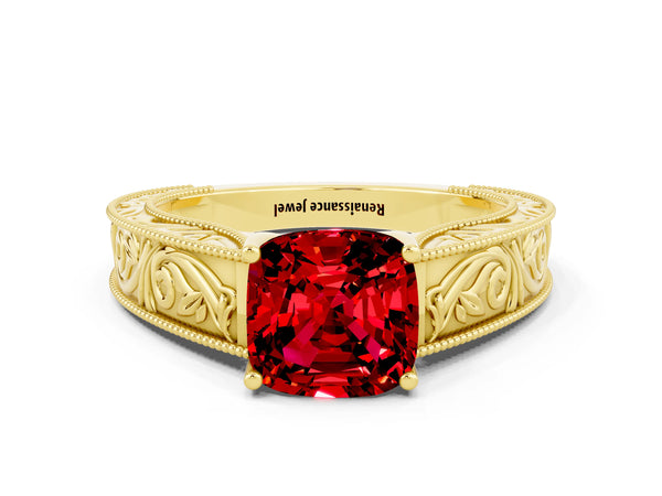 Yellow gold Cushion Cut Ruby Solitaire Ring with Engraved Band and Four-Prong Setting