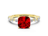 Yellow gold Cushion Cut Ruby Solitaire with Side Stones on a Pavé Band and Four-Prong Setting
