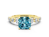 Yellow gold Cushion Cut Solitaire Blue Topaz Ring with Pave Band and Four-Prong Setting