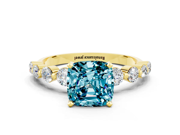 Yellow gold Cushion Cut Solitaire Blue Topaz Ring with Pave Band and Four-Prong Setting