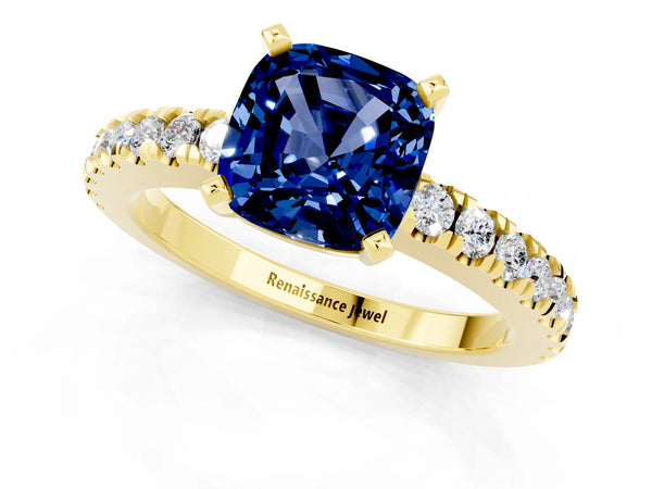 Yellow gold Cushion Cut Solitaire Blue Sapphire with Pavé Band and Four-Prong Setting