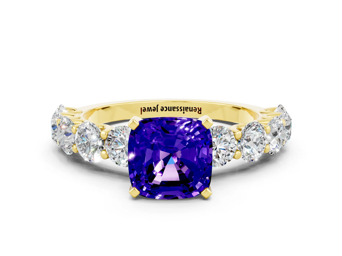 Yellow gold Cushion Cut Tanzanite Prong Setting with Side Stones on a Pave Band