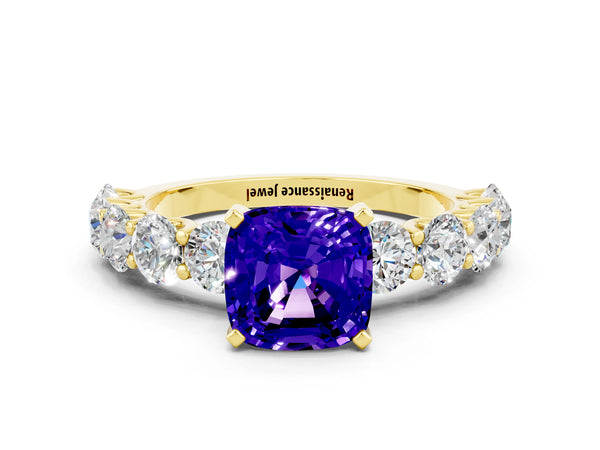 Yellow gold Cushion Cut Tanzanite Prong Setting with Side Stones on a Pave Band